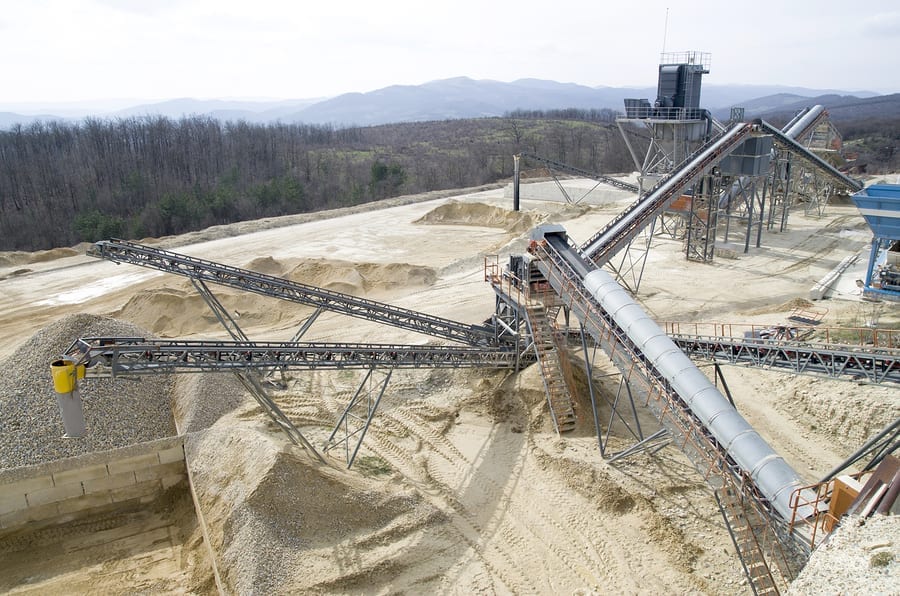 Two belt conveyors in Gravel Quarry in cloudy day